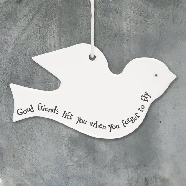 Porcelain bird 'Good Friends Lift You When You Forget To Fly'.